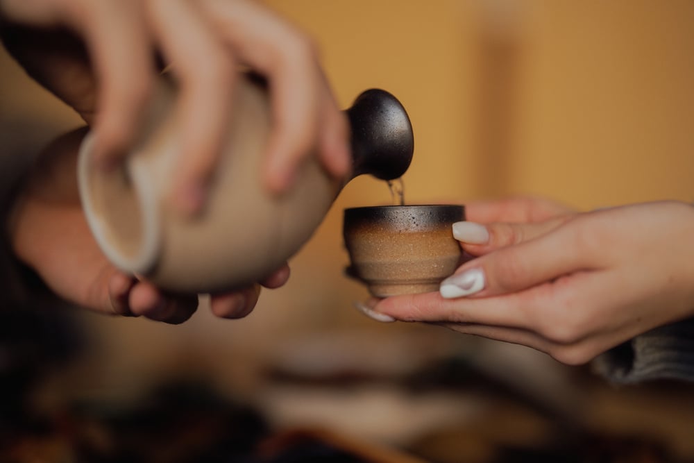 A Person Pouring Sake